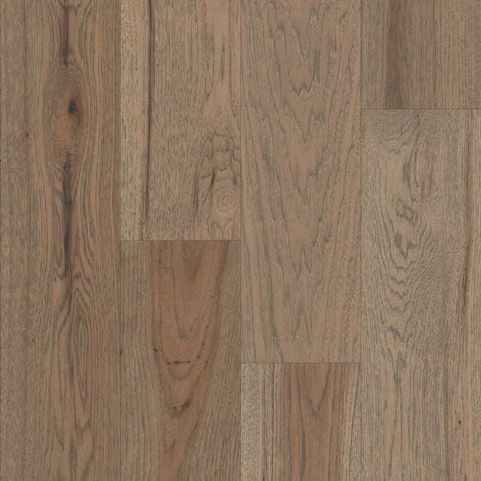 Close-up of wooden flooring with a brown and beige color scheme.